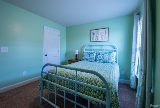 carpeted bedroom with baseboards