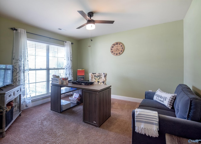 office with carpet floors, ceiling fan, visible vents, and baseboards