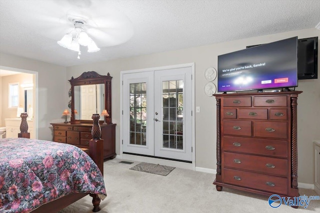 carpeted bedroom featuring ceiling fan, access to exterior, french doors, and multiple windows