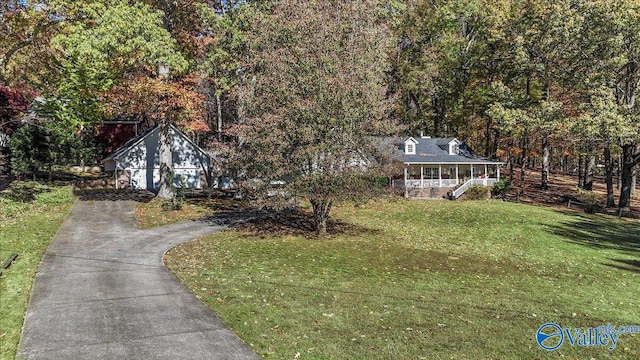 view of front facade featuring a front lawn and covered porch