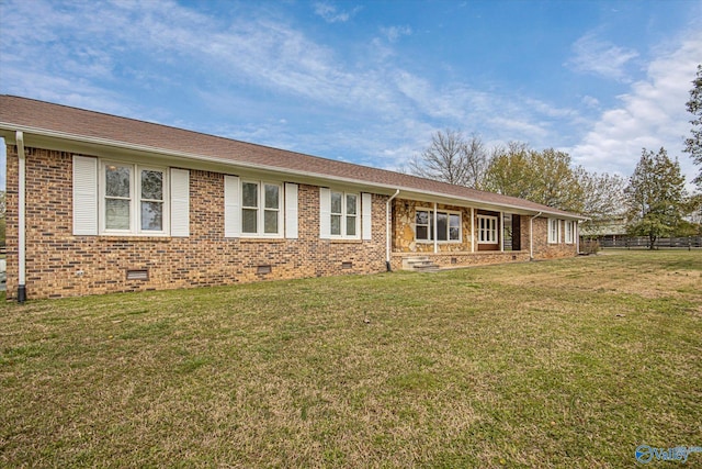 ranch-style house featuring a front lawn