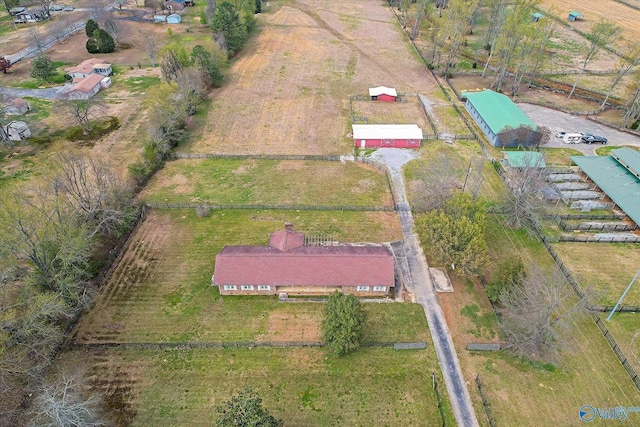 birds eye view of property featuring a rural view