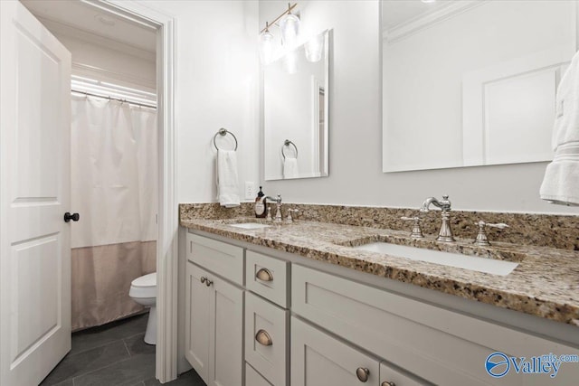 bathroom with vanity, tile patterned floors, crown molding, a shower with shower curtain, and toilet