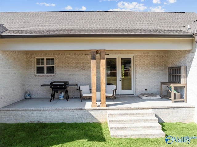 rear view of house featuring a patio area and french doors