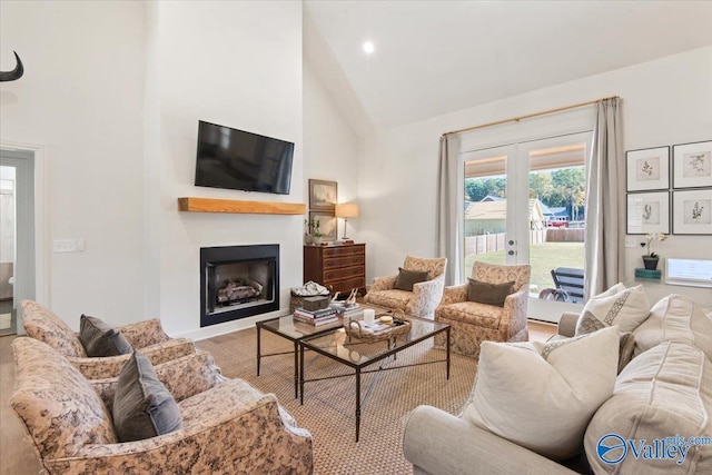 living room featuring french doors and high vaulted ceiling