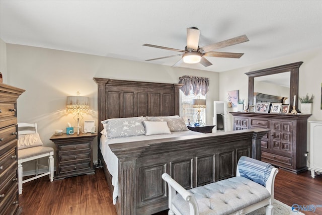 bedroom featuring dark wood-style floors and a ceiling fan