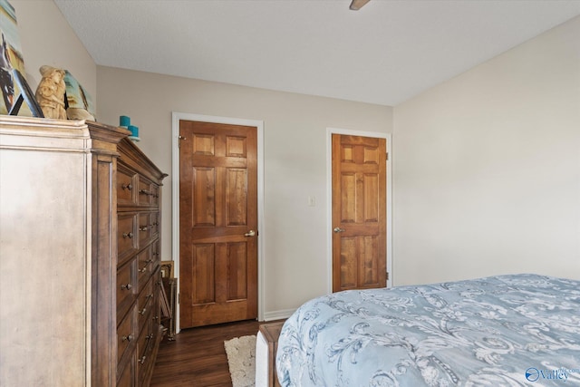 bedroom featuring dark wood-style floors and ceiling fan