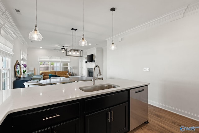 kitchen with decorative light fixtures, stainless steel dishwasher, dark wood-type flooring, sink, and ceiling fan