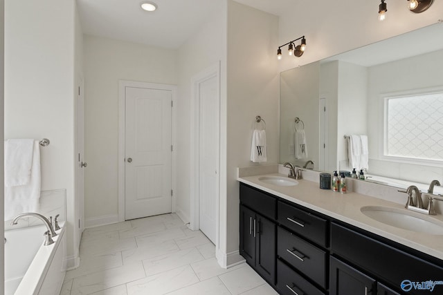 bathroom featuring vanity and a bathtub