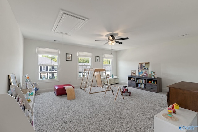 playroom with carpet and ceiling fan