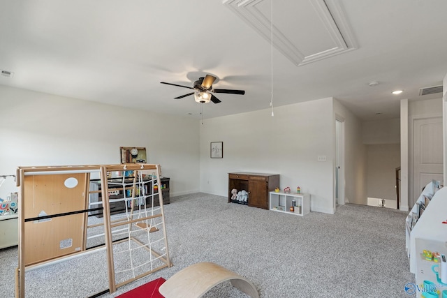 living room featuring ceiling fan and carpet