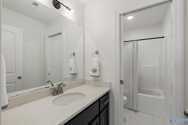 full bathroom featuring toilet, shower / tub combo with curtain, and vanity