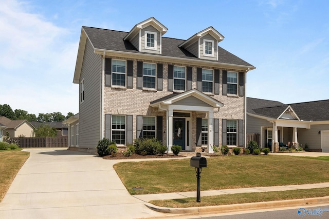 colonial-style house with a front yard