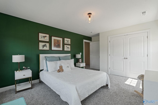 carpeted bedroom featuring a closet