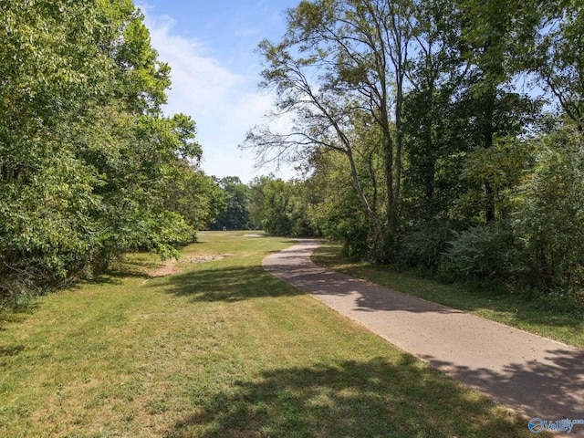 view of home's community featuring a yard