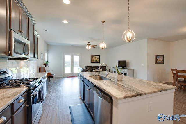 4304 Adventura Dr, Owens Cross Roads, AL 35763 - kitchen with stainless steel appliances, a sink, wood finished floors, a ceiling fan, and recessed lighting