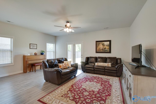 4304 Adventura Dr, Owens Cross Roads, AL 35763 - living room featuring ceiling fan, light wood-type flooring, and baseboards
