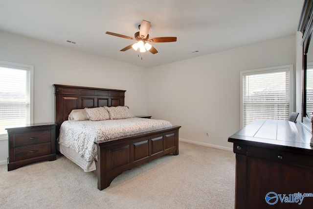 4304 Adventura Dr, Owens Cross Roads, AL 35763 - bedroom featuring light colored carpet, multiple windows, baseboards, and a ceiling fan