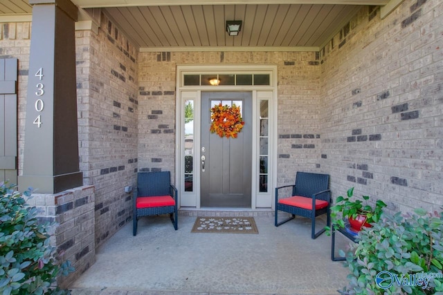 4304 Adventura Dr, Owens Cross Roads, AL 35763 - doorway to property featuring brick siding and covered porch
