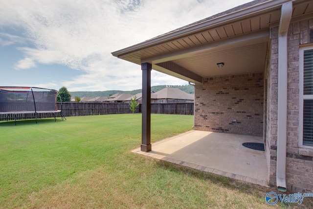 4304 Adventura Dr, Owens Cross Roads, AL 35763 - view of yard featuring a trampoline and a patio