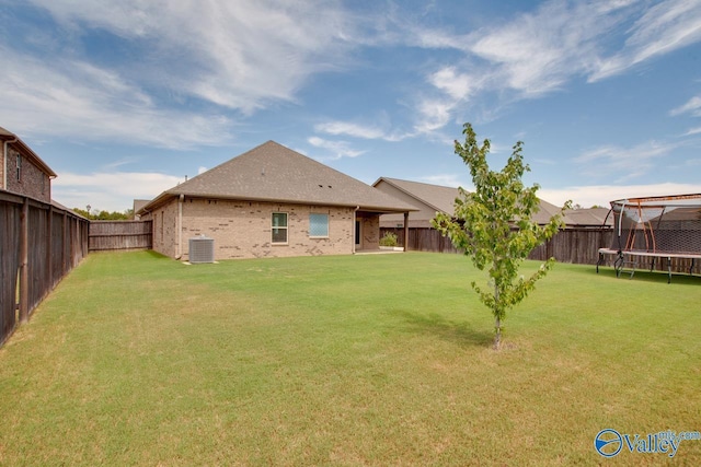 4304 Adventura Dr, Owens Cross Roads, AL 35763 - rear view of property with a trampoline, cooling unit, and brick siding