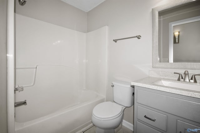 full bathroom featuring tub / shower combination, vanity, and toilet