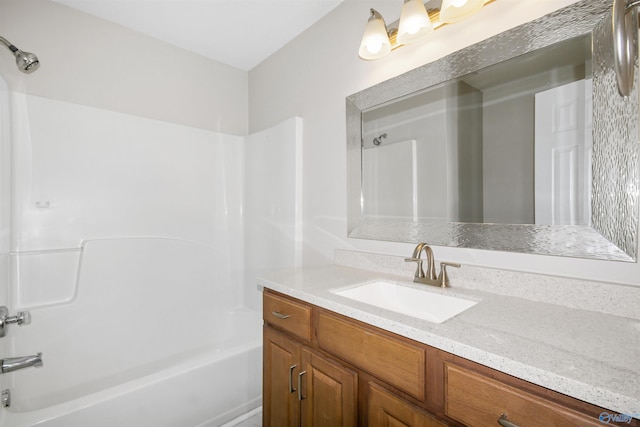 bathroom with vanity and bathing tub / shower combination