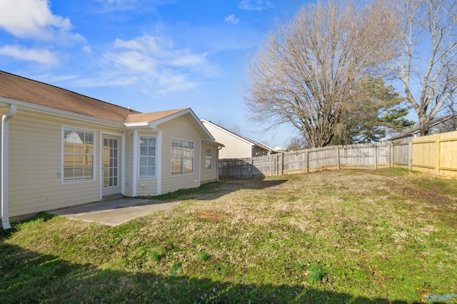 view of yard with a patio area and a fenced backyard