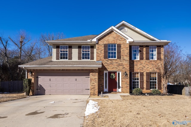 view of front of property with brick siding, a shingled roof, fence, a garage, and driveway