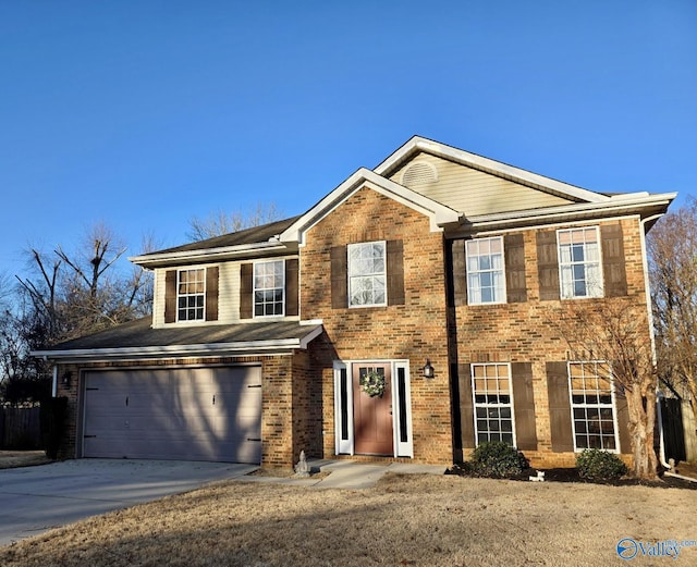 view of front of house with brick siding, driveway, and an attached garage