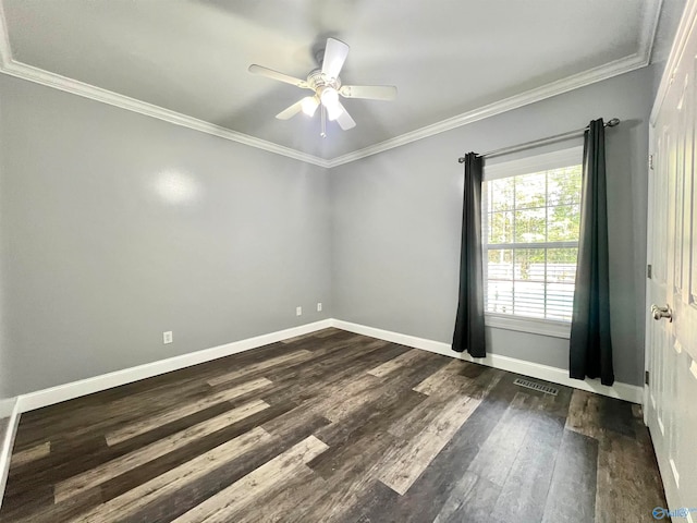 empty room with ornamental molding, ceiling fan, and dark hardwood / wood-style floors