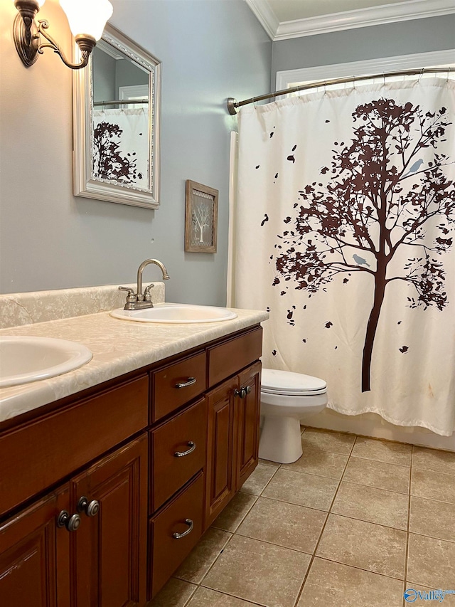 bathroom with vanity, tile patterned flooring, toilet, and crown molding
