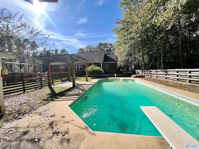 view of swimming pool with a pergola and a diving board