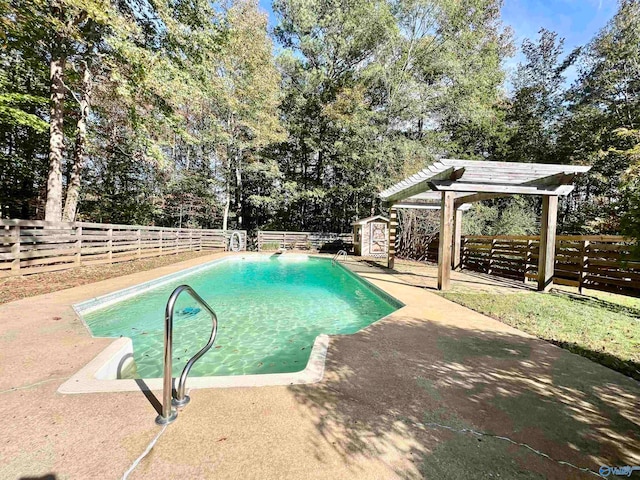 view of pool with a storage shed, a patio, and a pergola