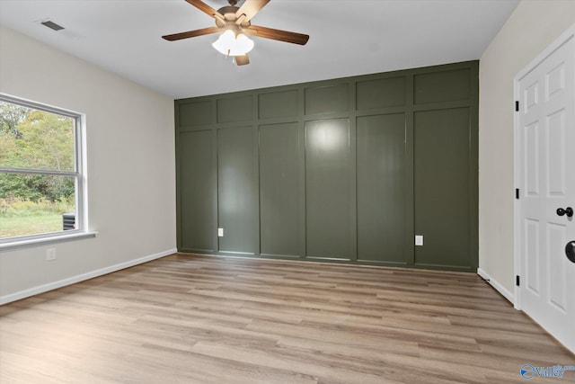 unfurnished bedroom featuring ceiling fan and light hardwood / wood-style floors