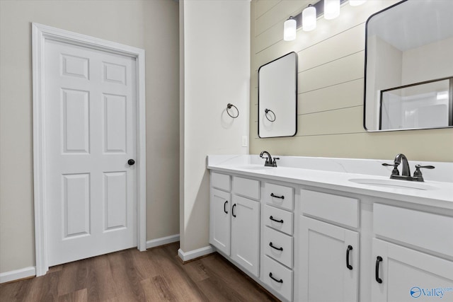 bathroom with vanity and hardwood / wood-style flooring