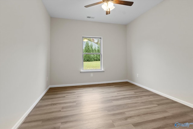 empty room featuring light hardwood / wood-style floors and ceiling fan