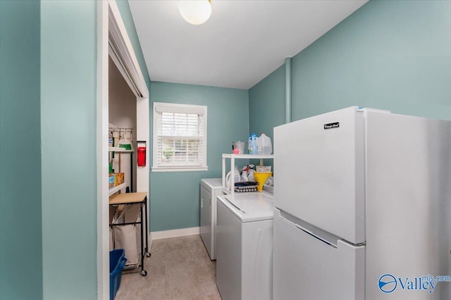 laundry room featuring washer and dryer, laundry area, and baseboards