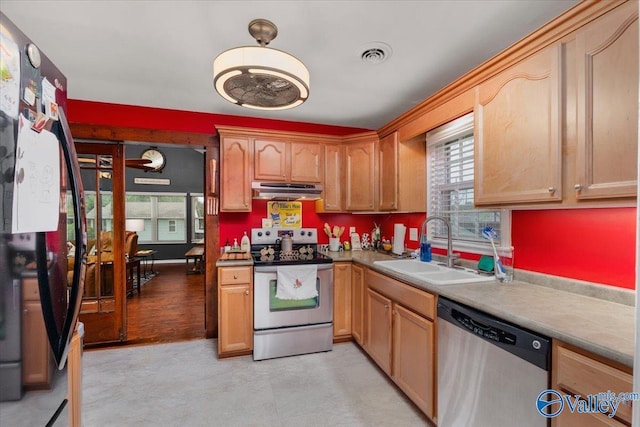 kitchen featuring a sink, a healthy amount of sunlight, visible vents, and stainless steel appliances