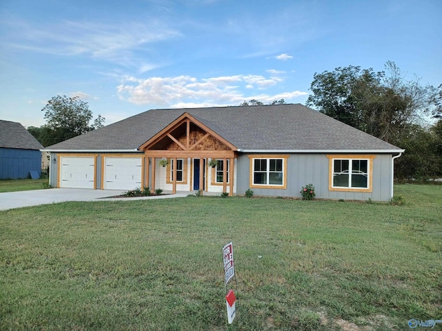 view of front facade featuring a garage and a front lawn