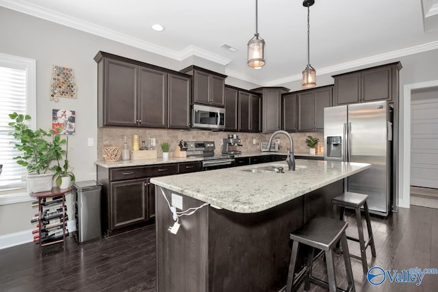 kitchen with stainless steel appliances, dark hardwood / wood-style floors, crown molding, and sink