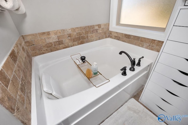 bathroom featuring a tub to relax in