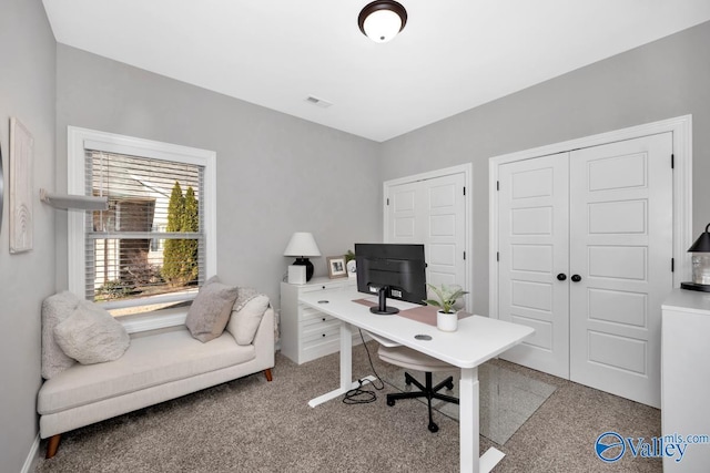 home office with light carpet