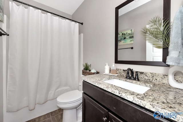 full bathroom with tile patterned flooring, vanity, toilet, and shower / bath combo with shower curtain