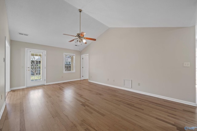 unfurnished living room featuring visible vents, a ceiling fan, light wood finished floors, baseboards, and vaulted ceiling