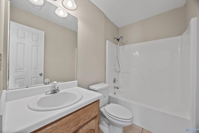 bathroom featuring tile patterned floors, toilet, vanity, and bathtub / shower combination