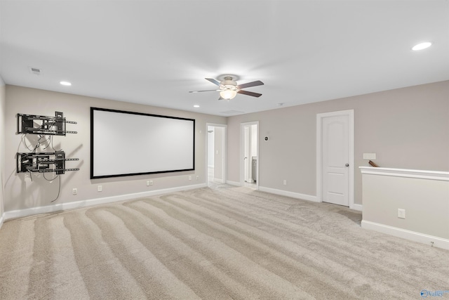 cinema featuring light carpet and ceiling fan