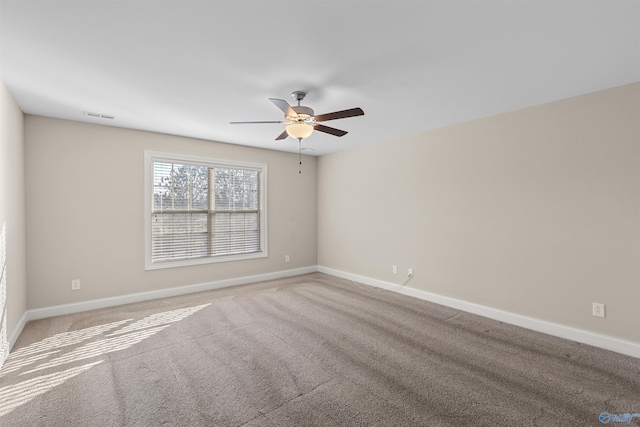 unfurnished room with ceiling fan and carpet flooring