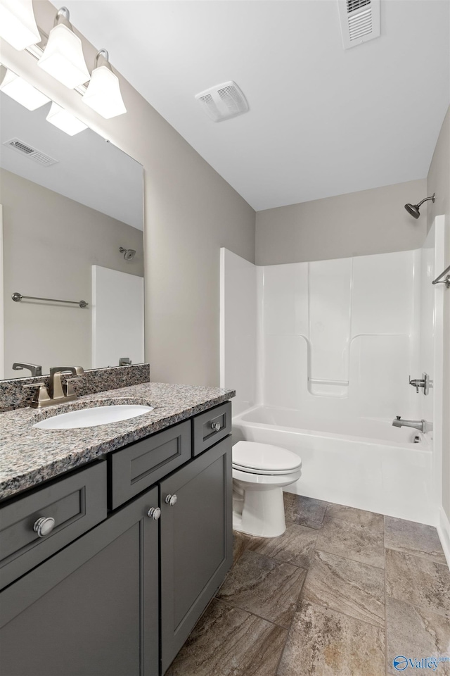 full bathroom with toilet, vanity, and bathing tub / shower combination