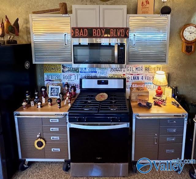 kitchen featuring appliances with stainless steel finishes and light countertops